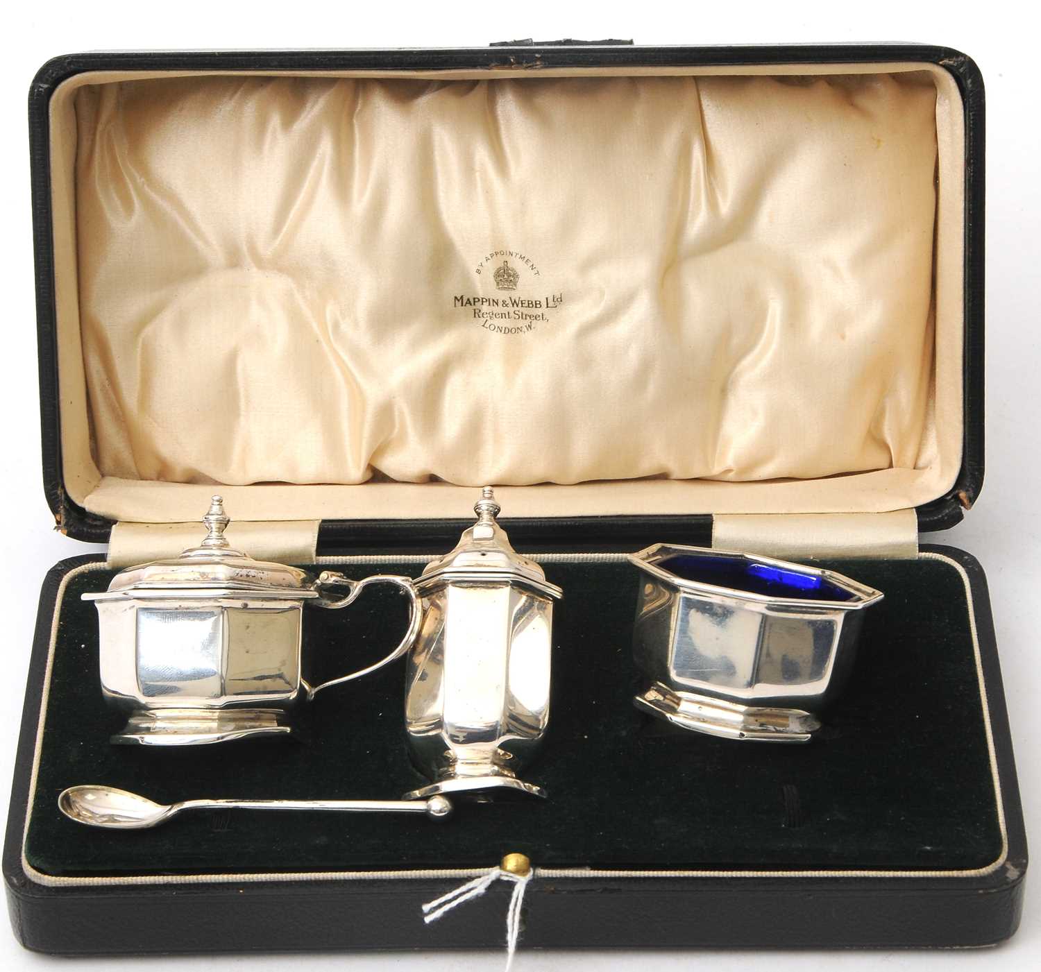 Lot 95 - A cased Art Deco three piece silver condiment...