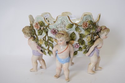 Lot 62 - Continental porcelain flower vase supported by...
