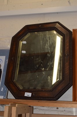 Lot 545 - An oak framed octagonal wall mirror