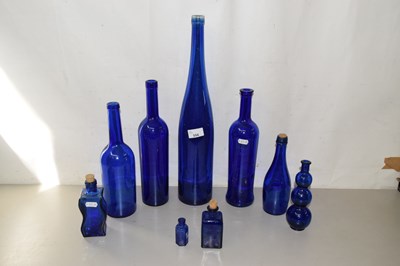 Lot 556 - Collection of blue glass bottles