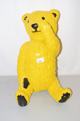 Lot 578 - A yellow painted teddy bear model