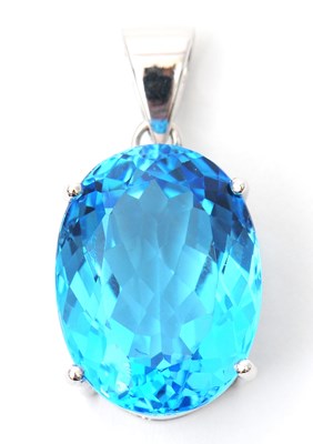 Lot 43 - A 9ct white gold topaz pendant, the oval...