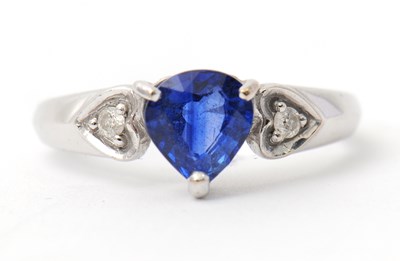Lot 10 - An 18ct sapphire and diamond ring, the pear...