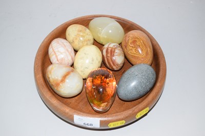 Lot 668 - A bowl of polished stone eggs