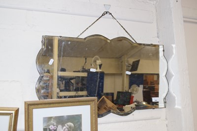Lot 692 - A 1930's bevelled wall mirror in clip frame