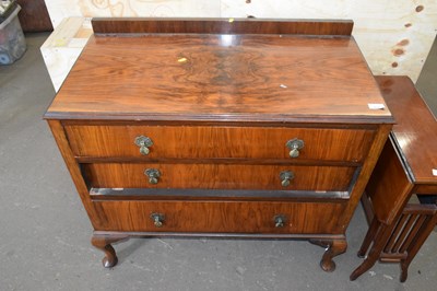 Lot 819 - A walnut veneered three drawer chest