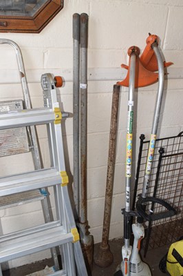 Lot 884 - A post hole digger and a further compactor