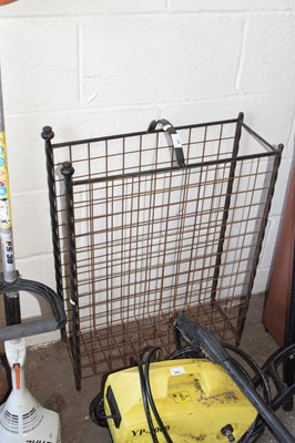 Lot 887 - An iron firewood rack