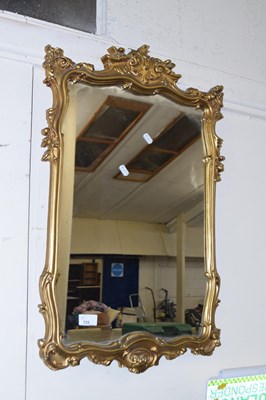Lot 715 - A modern wall mirror in gilt effect frame