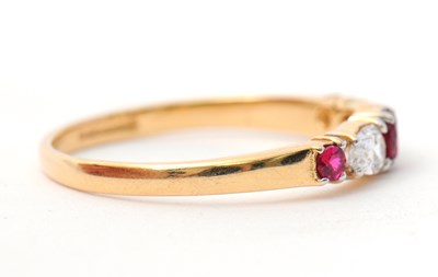 Lot 26 - A 14ct ruby and diamond ring, with central...