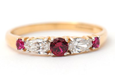 Lot 26 - A 14ct ruby and diamond ring, with central...