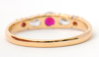 Lot 26 - A 14ct ruby and diamond ring, with central...