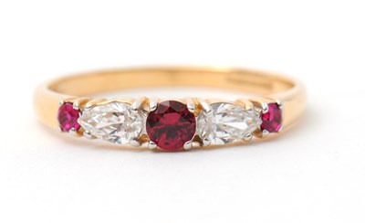 Lot 26 - A 14ct ruby and diamond ring, with central...