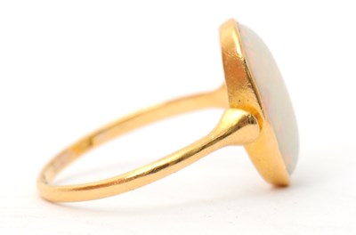 Lot 28 - An opal ring, with single oval opal cabochon,...