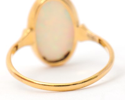 Lot 28 - An opal ring, with single oval opal cabochon,...