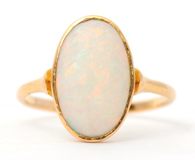 Lot 28 - An opal ring, with single oval opal cabochon,...