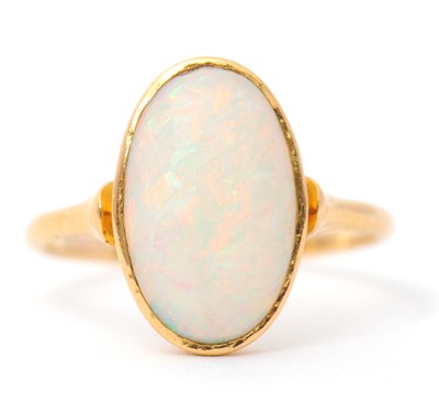 Lot 28 - An opal ring, with single oval opal cabochon,...