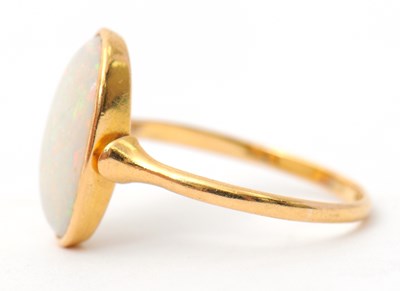 Lot 28 - An opal ring, with single oval opal cabochon,...