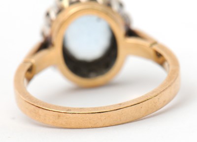 Lot 29 - A 9ct topaz and diamond cluster ring, the...