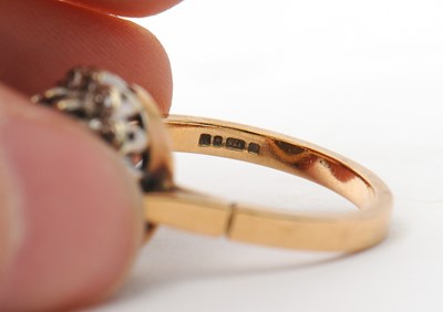 Lot 29 - A 9ct topaz and diamond cluster ring, the...