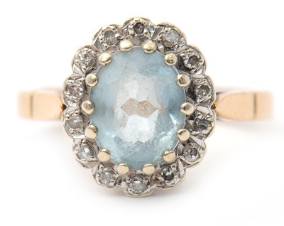 Lot 29 - A 9ct topaz and diamond cluster ring, the...