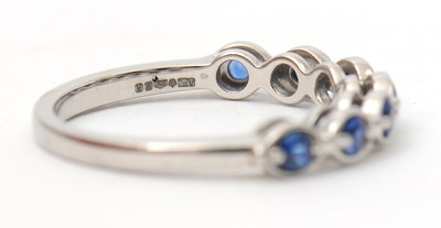 Lot 34 - A platinum sapphire ring, with seven round...