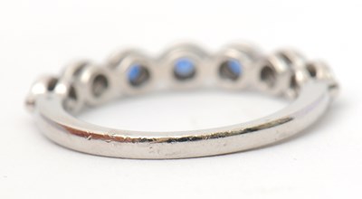 Lot 34 - A platinum sapphire ring, with seven round...