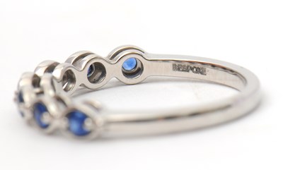 Lot 34 - A platinum sapphire ring, with seven round...