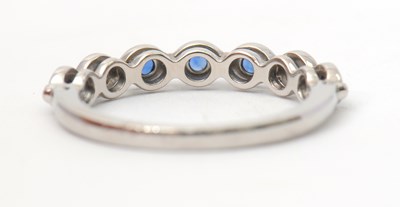 Lot 34 - A platinum sapphire ring, with seven round...