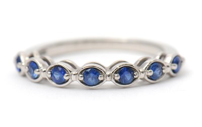 Lot 34 - A platinum sapphire ring, with seven round...