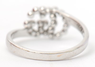 Lot 35 - A diamond ring, with two interlocking diamond...