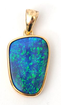 Lot 72 - A 9ct opal pendant, with off-oval opal in...