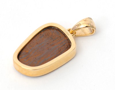 Lot 72 - A 9ct opal pendant, with off-oval opal in...