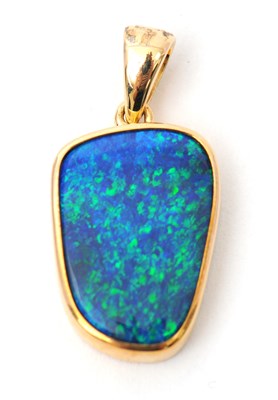 Lot 72 - A 9ct opal pendant, with off-oval opal in...