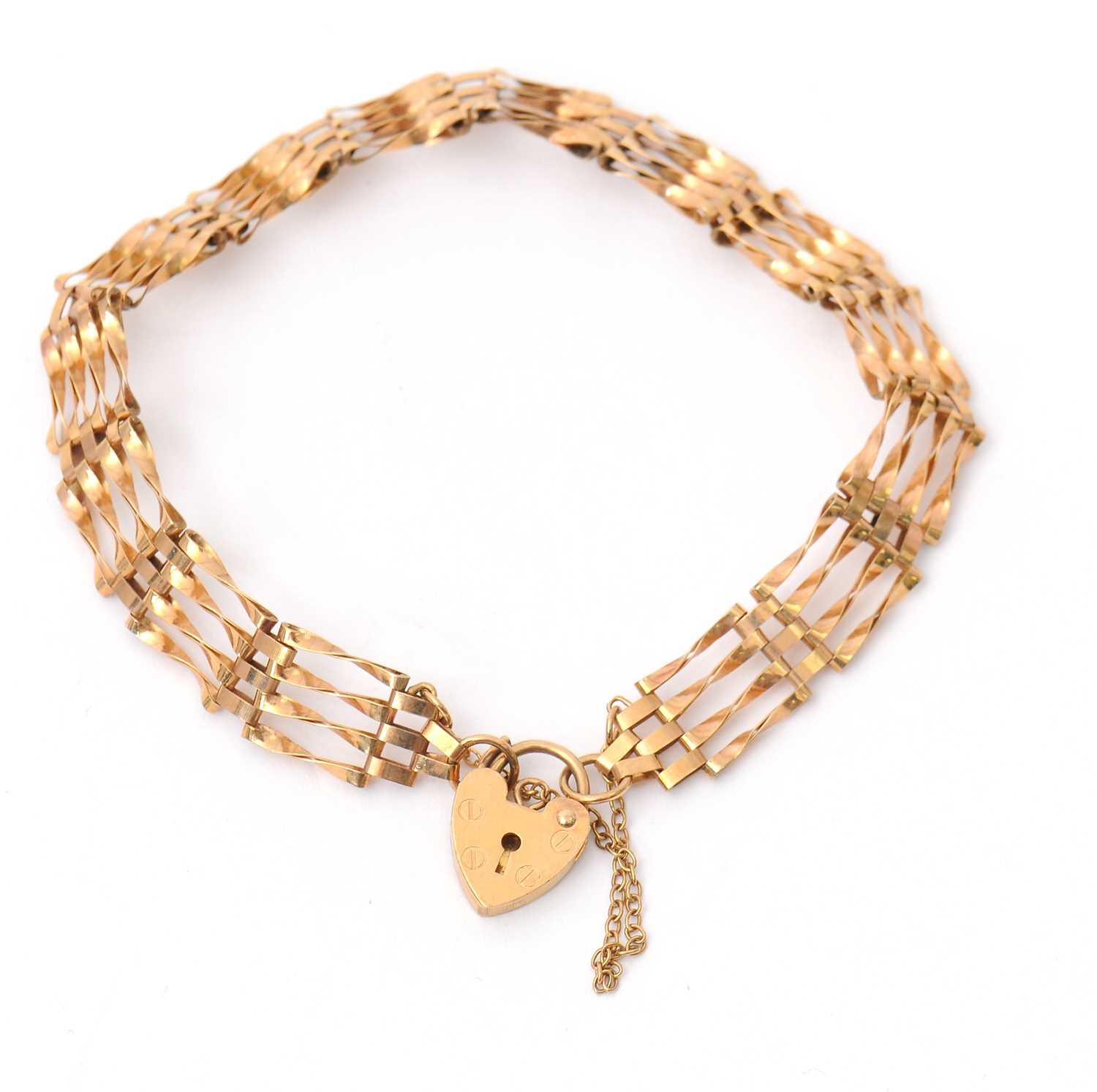 Lot 86 - A 9ct gate bracelet, 8.5mm wide, with padlock...