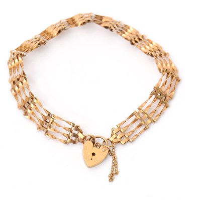 Lot 86 - A 9ct gate bracelet, 8.5mm wide, with padlock...