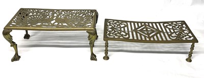 Lot 264 - Two brass trivets, one decorated with peacocks...