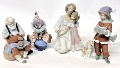 Lot 282 - A group of four Lladro figurines including two...