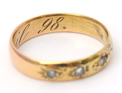 Lot 31 - A diamond ring, set with three small rose cut...