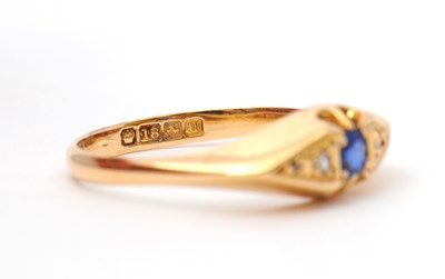Lot 36 - An 18ct sapphire and diamond ring, with...