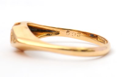 Lot 36 - An 18ct sapphire and diamond ring, with...