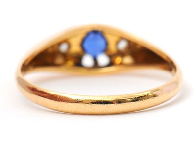 Lot 36 - An 18ct sapphire and diamond ring, with...