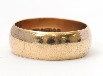 Lot 118 - A 9ct wedding band, 8mm wide, hallmarked...