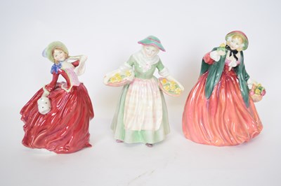 Lot 143 - Group of three Royal Doulton figures...