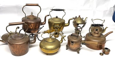 Lot 304 - A quantity of vintage copper and brass kettles,...