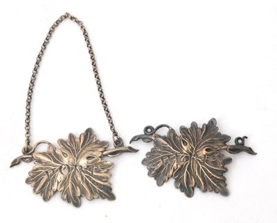 Lot 106 - Two William IV silver vine leaf spirit labels,...