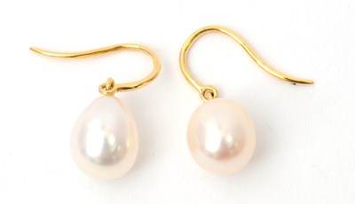 Lot 66 - A pair of cultured pearl earrings, the oval...