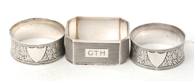 Lot 110 - A pair of Edwardian silver serviette rings,...