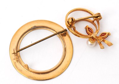 Lot 61 - Two brooches: to include a 9ct garnet and...