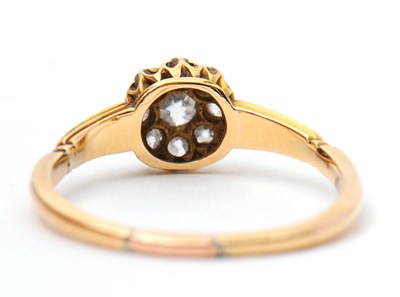 Lot 39 - A diamond ring, the small round cluster set...